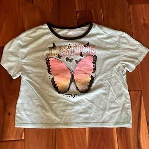 Blue shirt with butterfly on the front